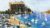Painting a Coastal Landscape with Boats and Buildings